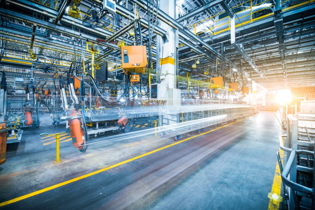 Picture of robots welding in a car factory.
